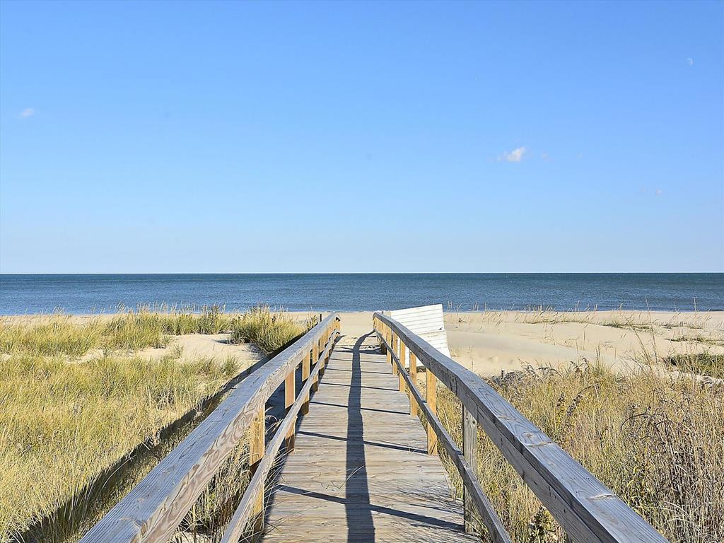 image Feel the ocean breeze as you step onto the boardwalk, ready to dig your toes into the warm sand.