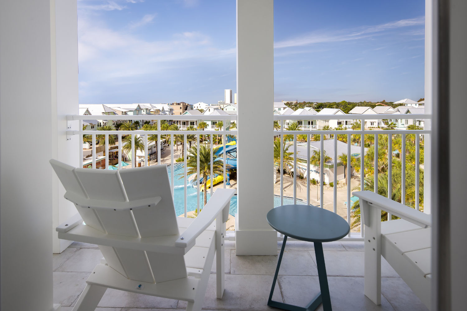 image Enjoy the stunning views of the lush surroundings and pool area from the cozy balcony seating.