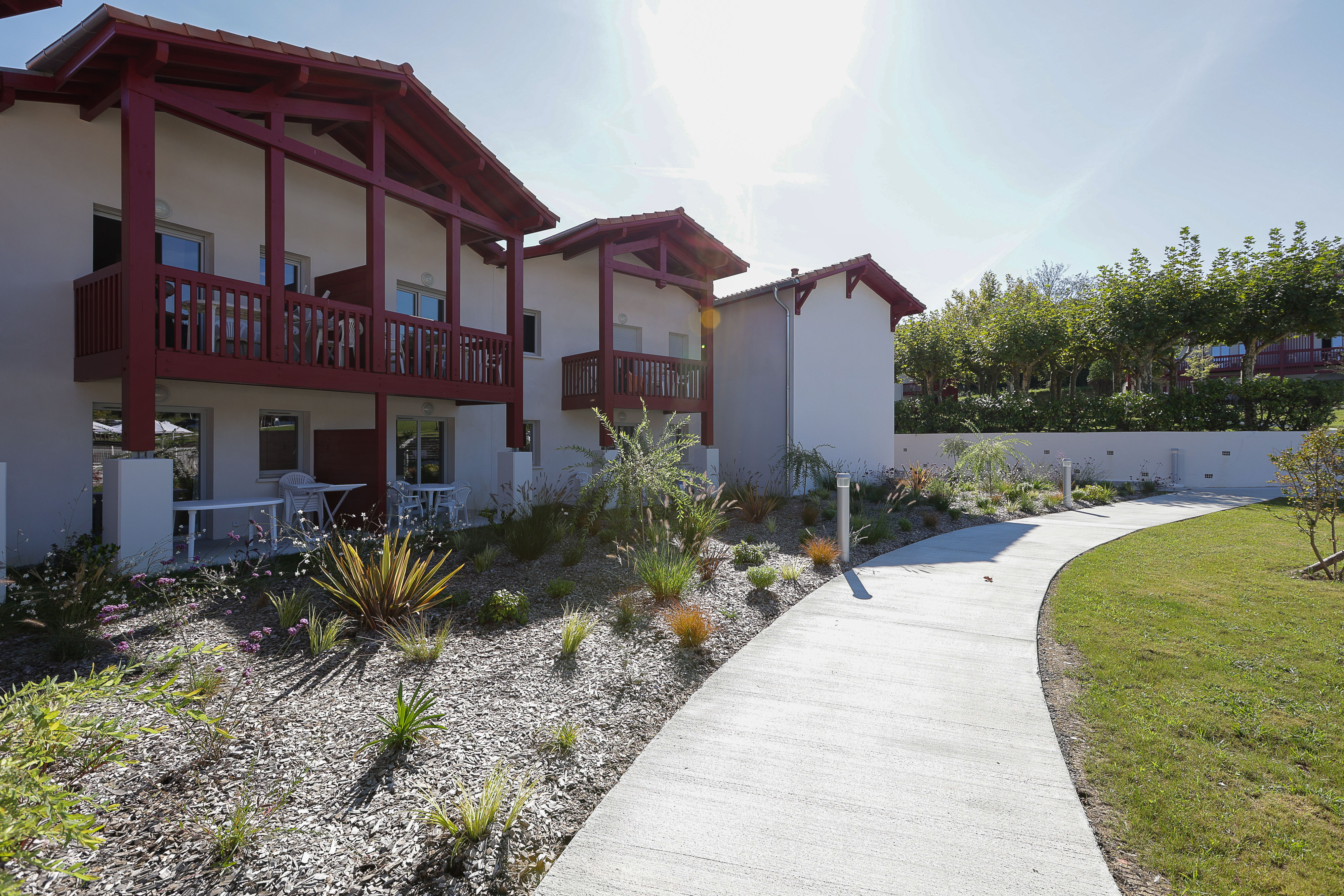image Arrive to beautifully landscaped grounds and classic Basque architecture — the welcoming setting of Le Domaine d'Uhaina, where space and comfort await groups of up to eight.