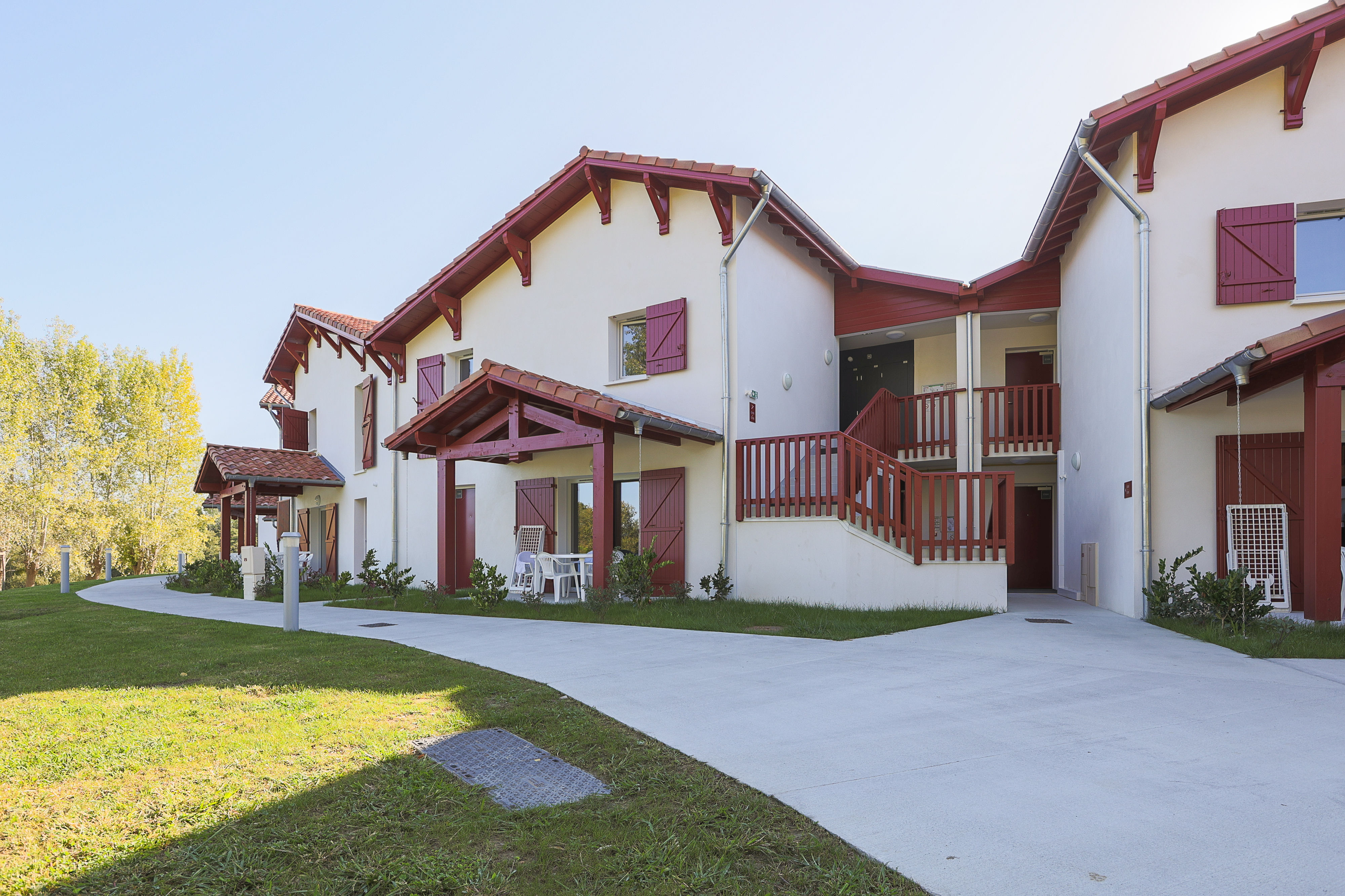 image These charming Basque-style apartments offer easy access to all resort amenities, with lush green surroundings that make coming back after a day out just as enjoyable.