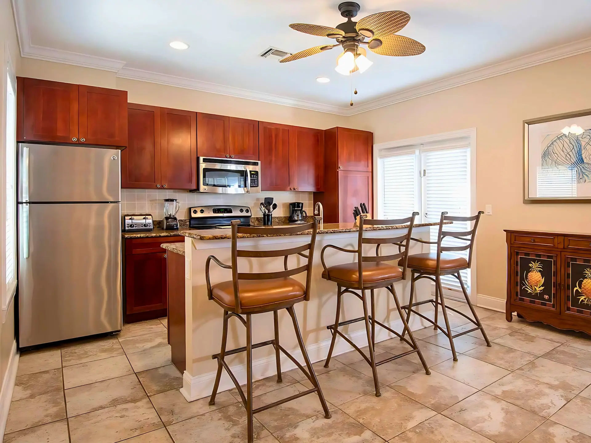 image Prepare meals in a welcoming kitchen featuring modern appliances and ample counter space.