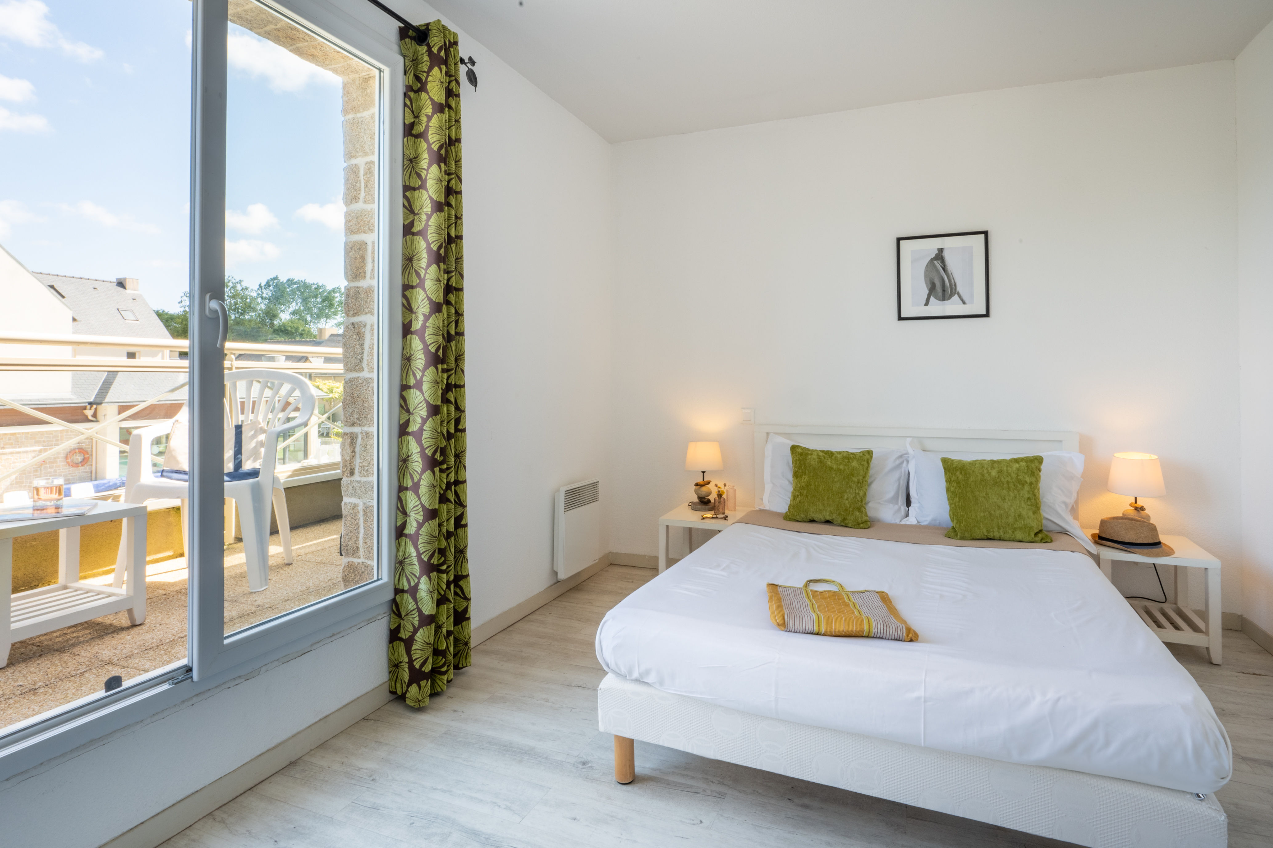 image The spacious double bedroom upstairs is a bright, serene space to retreat to after a full day discovering Saint-Malo and its coastline.