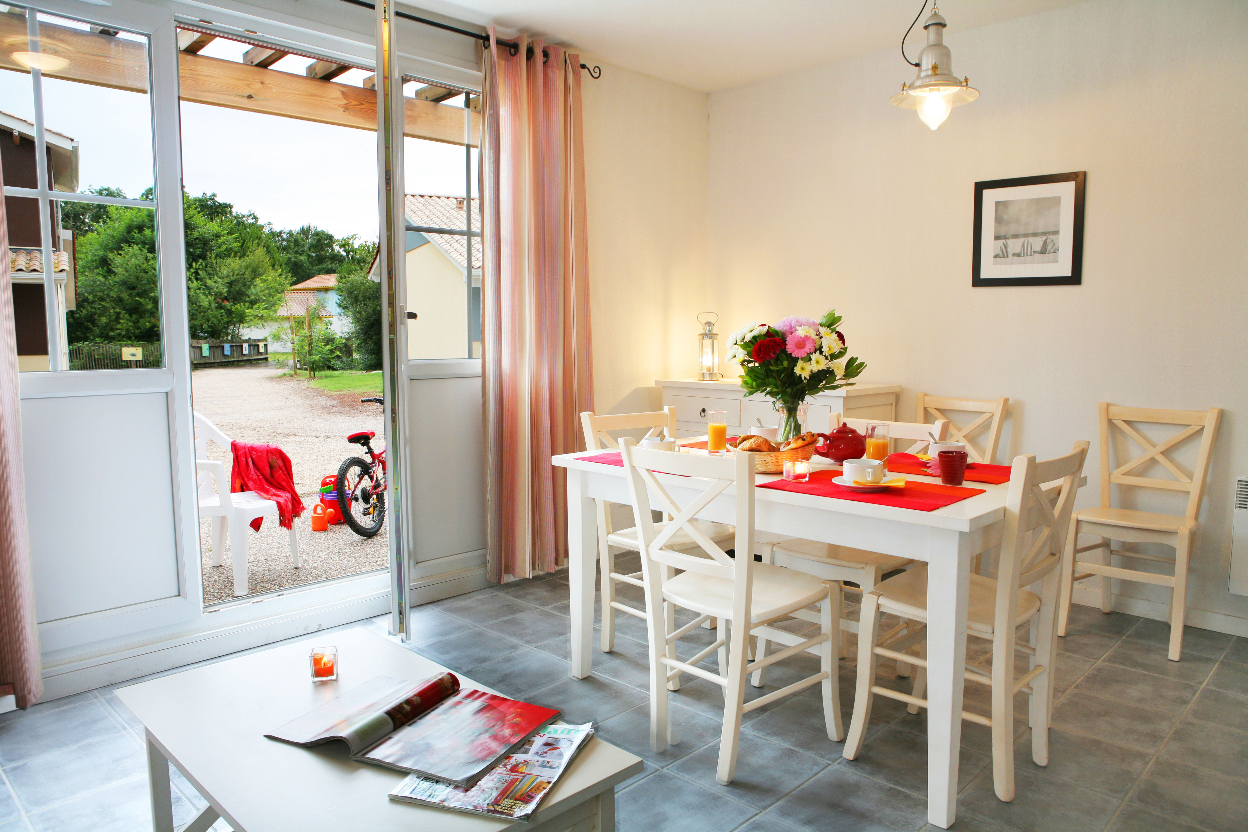 image The bright open living space flows out to the terrace, bringing the peaceful wooded setting right into your home.