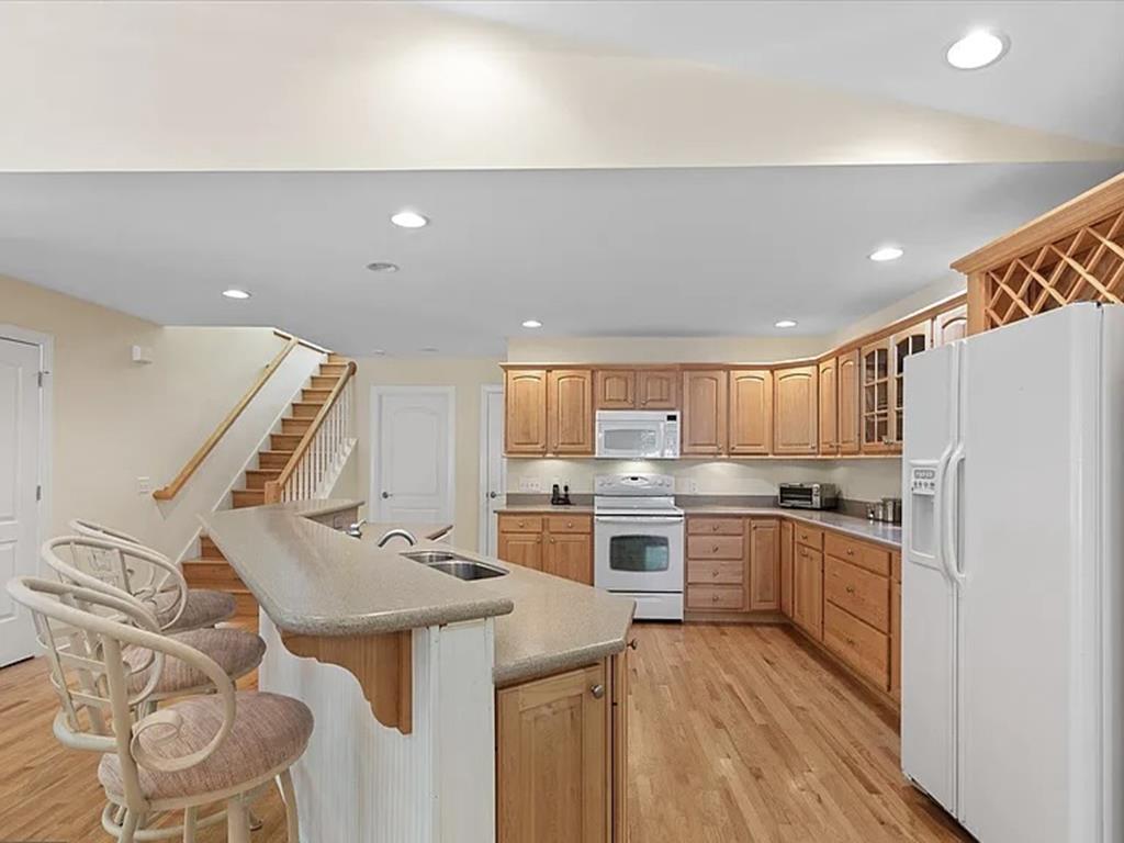 image Enjoy the clean lines and bright ambiance of a fully equipped kitchen, ready for your culinary adventures.