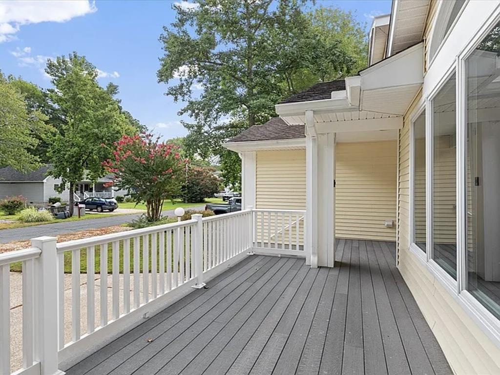 image Step onto the spacious outdoor deck, offering a serene space to enjoy fresh air and neighborhood vibes.