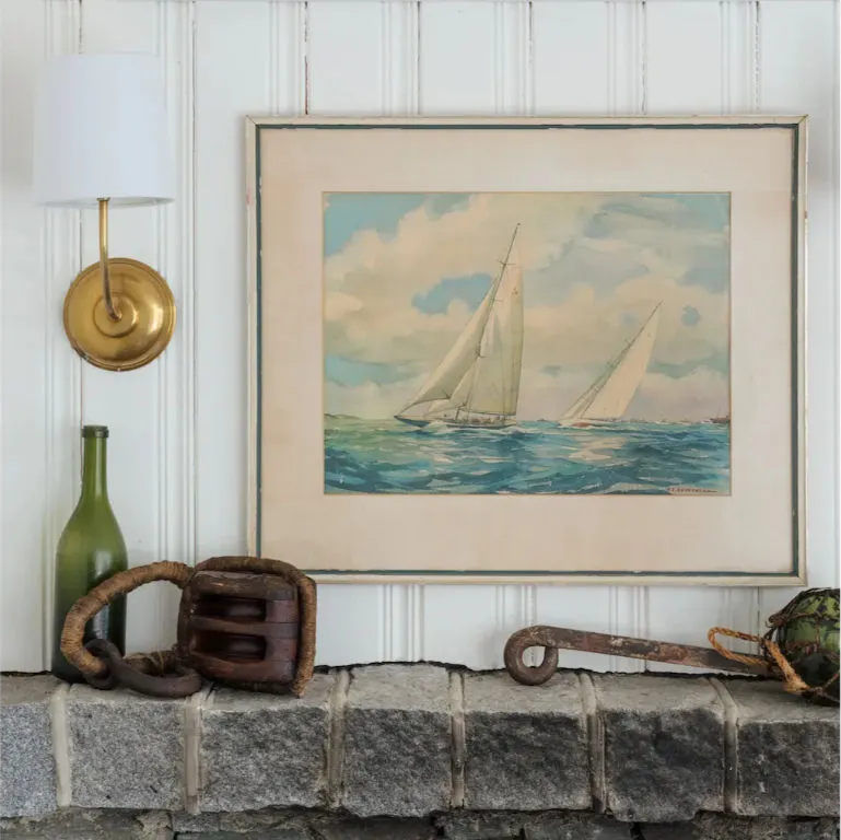 image Coastal accents and seafaring art tell quiet stories of wind, waves, and timeless charm.