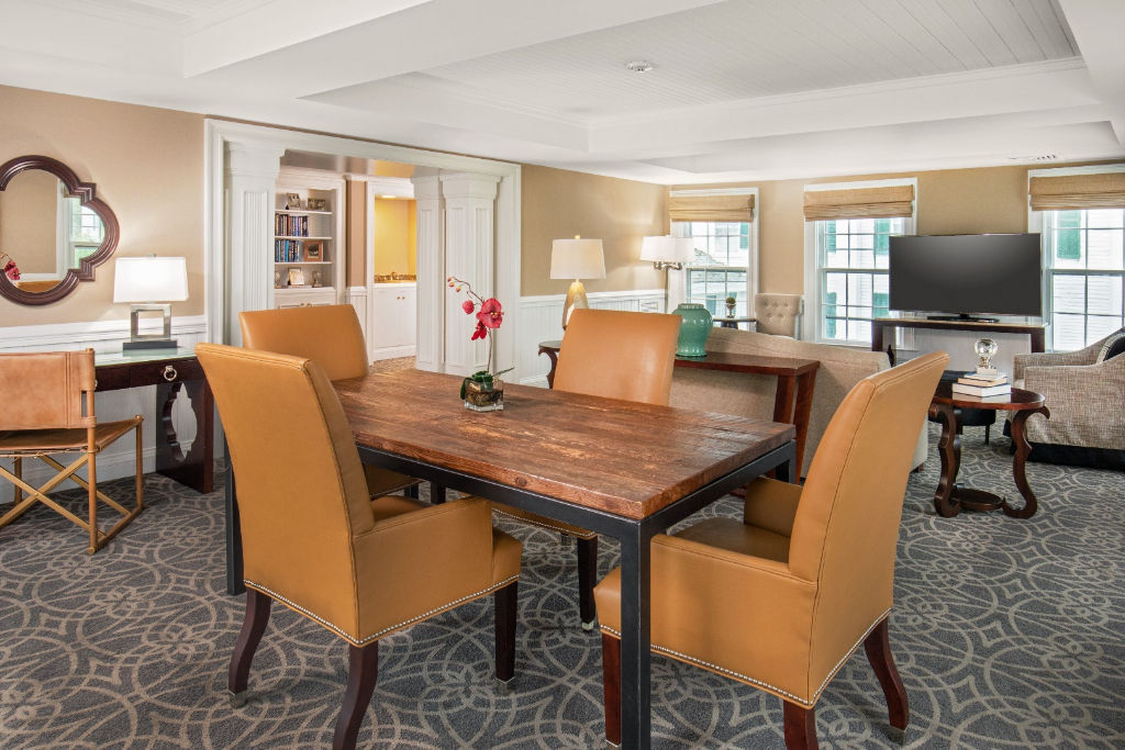 image Gather around the elegant table in this stylish dining nook, where meals and memories are made under the soft glow of ambient lighting.