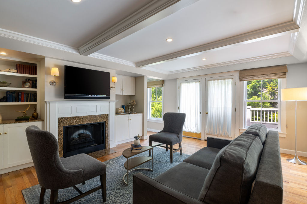 image Cozy lounge area with a fireplace, perfect for relaxing evenings indoors.