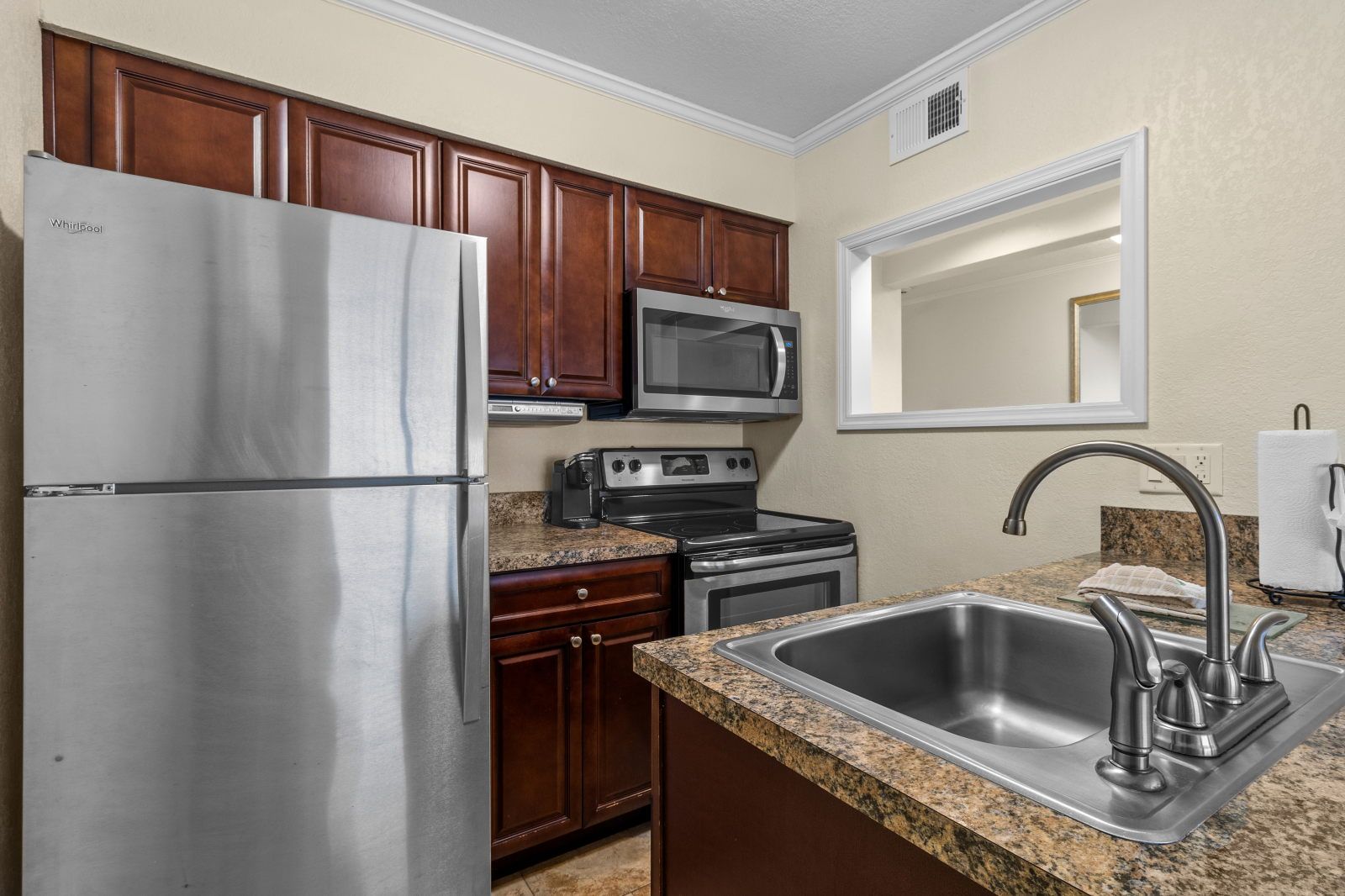 image Cook up your favorite dishes in a fully equipped kitchen, designed for effortless entertaining.