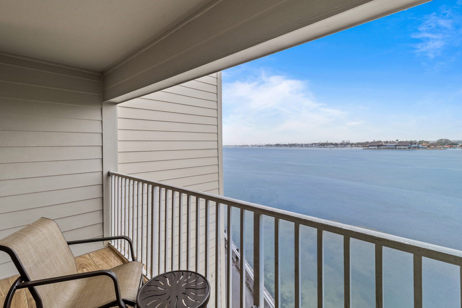 image Enjoy your morning coffee on the private balcony overlooking tranquil waters.