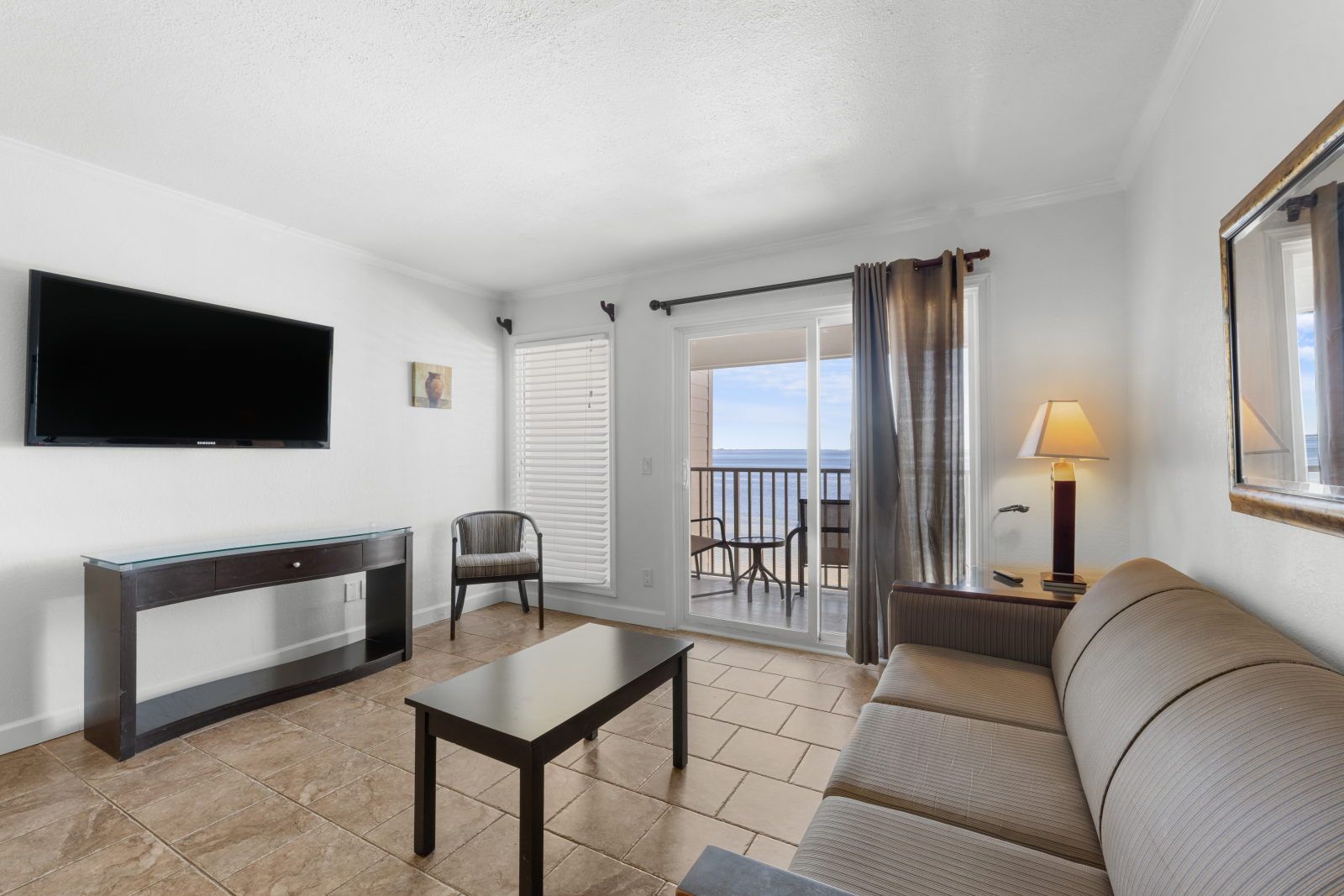 image Sip your morning coffee on the couch, taking in views from the balcony just beyond.
