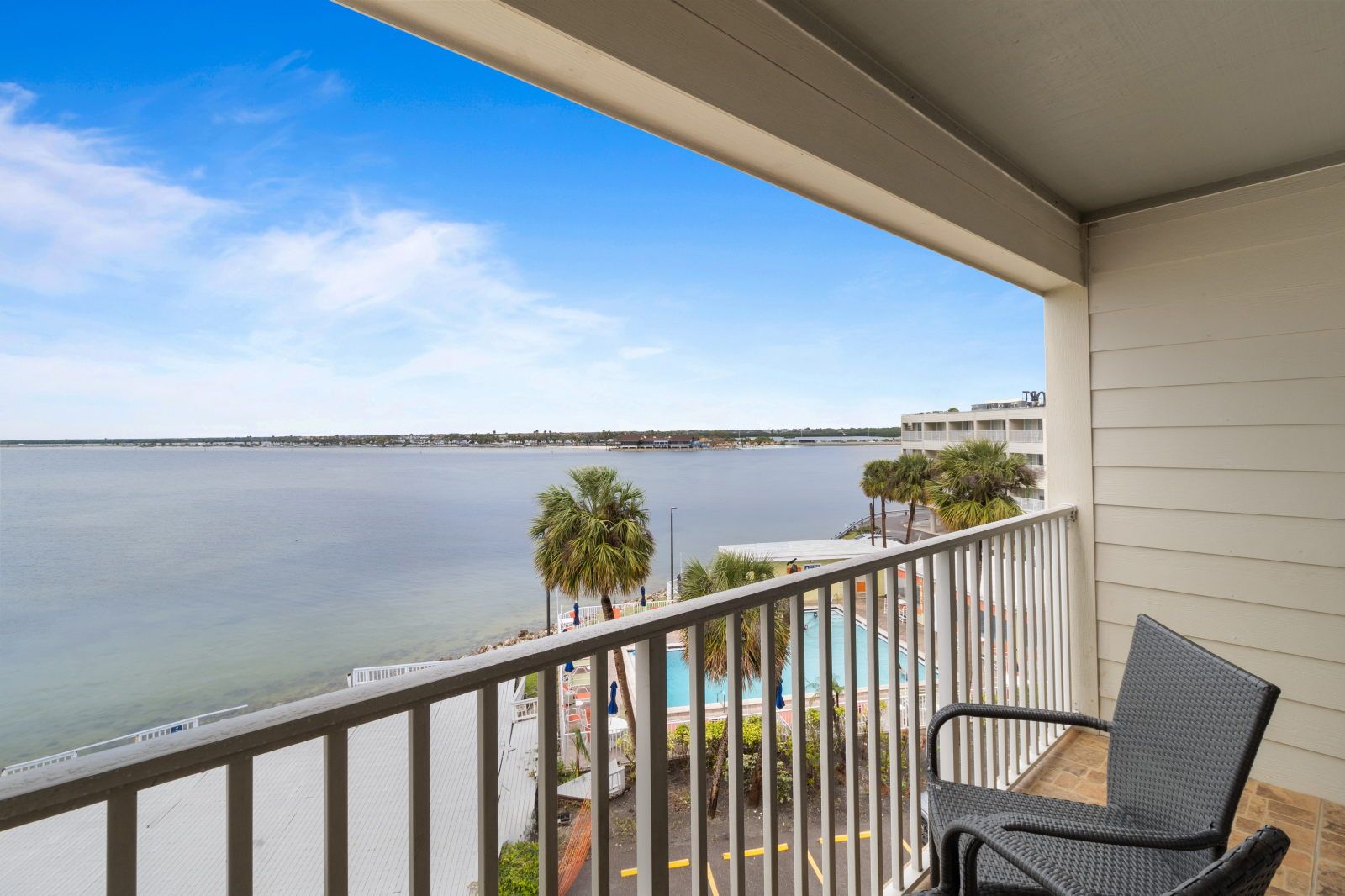 image Relax on your private balcony with stunning views of the serene Tampa Bay.