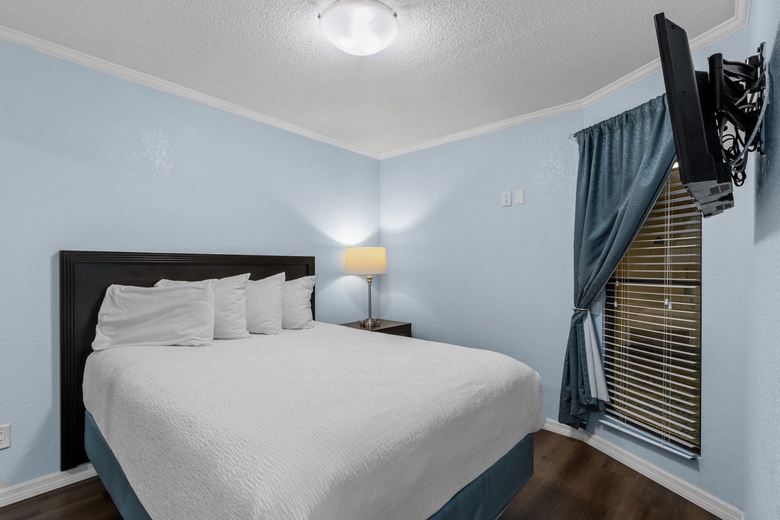 image Refresh in a cozy bedroom with soft bedding and modern touches.