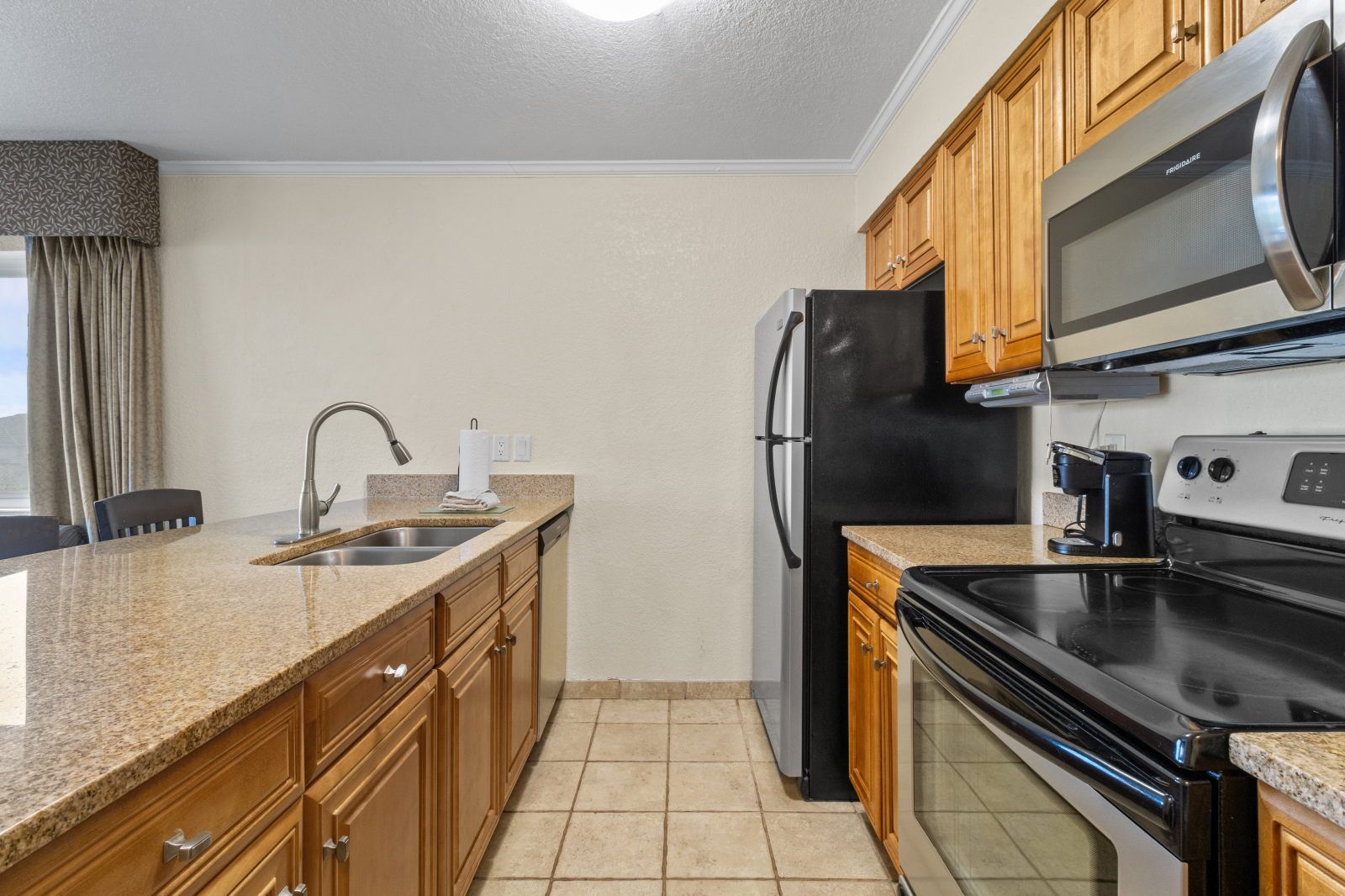 image Create culinary delights in a fully-equipped kitchen, featuring modern appliances and stylish finishes.