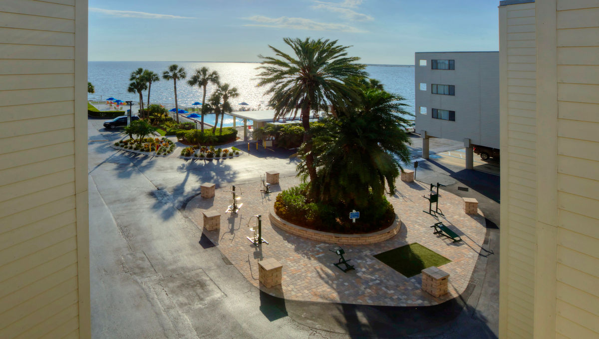 image The view frames both the pool and the bay, including the outdoor fitness area.