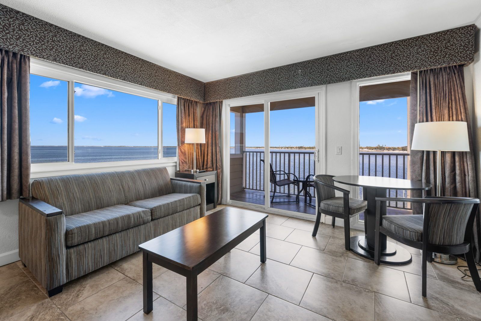 image Relax in the living area, where comfort meets stunning waterfront views.