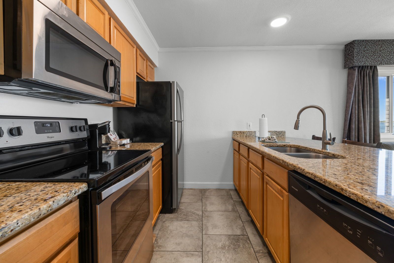 image Cook and unwind in this well-equipped kitchen, featuring modern appliances and ample counter space.