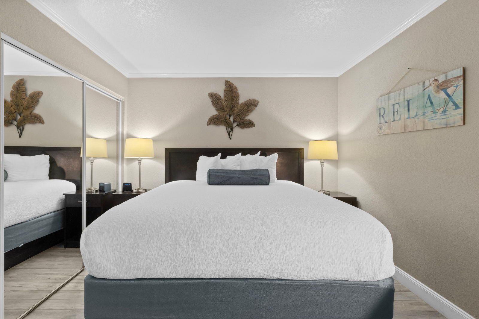 image Relax in your cozy king bed, complete with soft linens and soothing decor that invites you to unwind.
