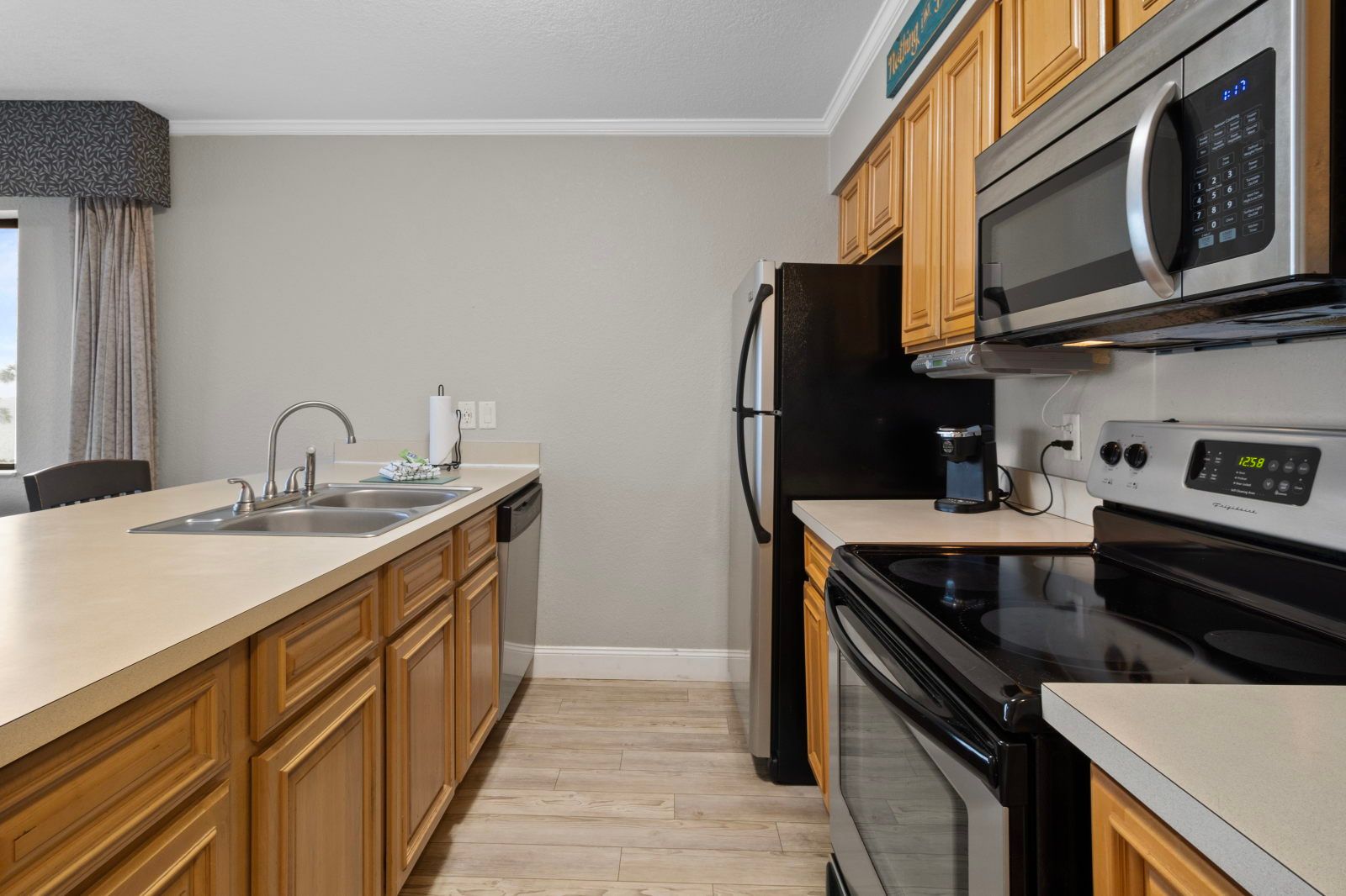 image Cook up your favorites in a spacious kitchen, fully equipped with modern appliances and sleek countertops.