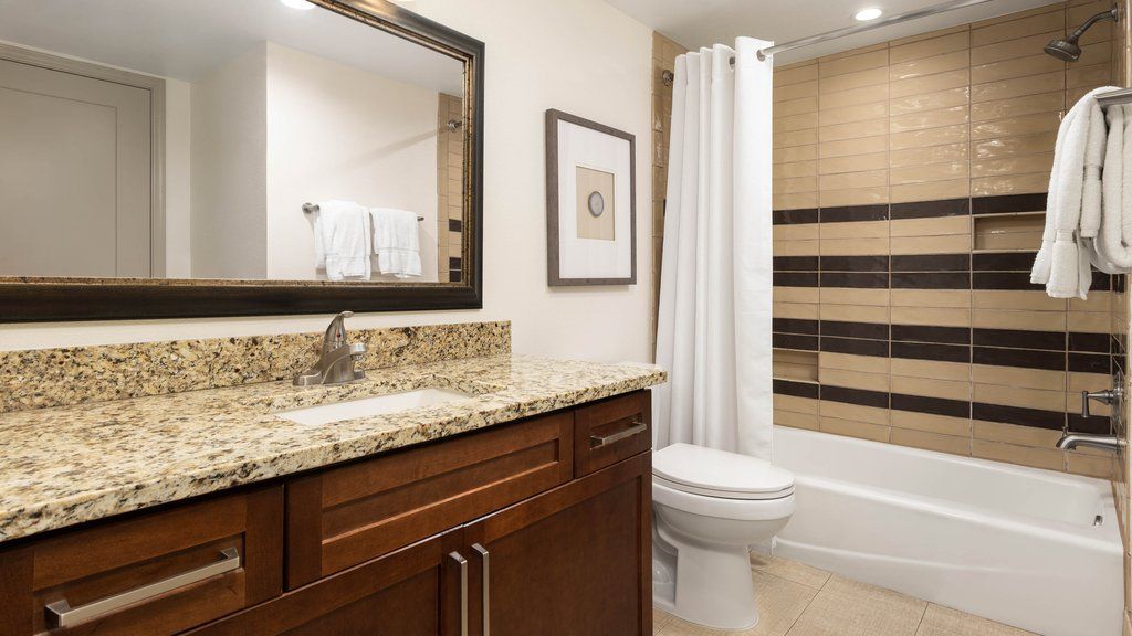image Relax in a stylish bathroom with modern fixtures and cozy towels waiting for you.