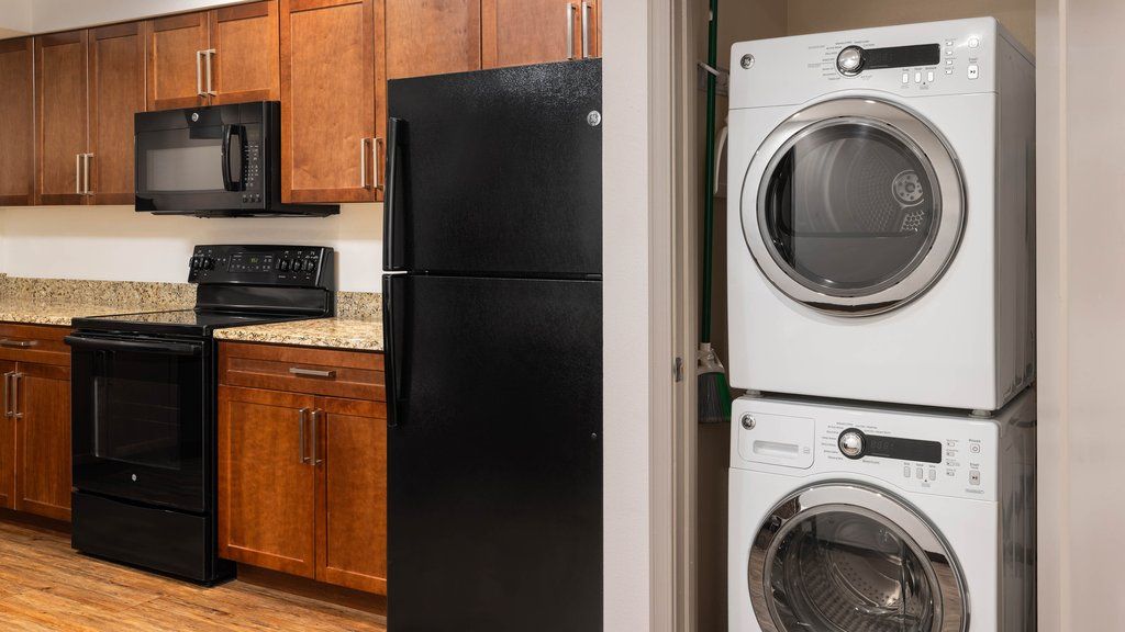 image Convenient in-suite laundry area with washer and dryer, making your stay comfortable and hassle-free.