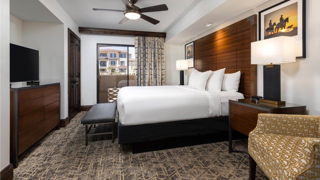 image Retreat to a cozy king bedroom, featuring plush bedding and stylish decor for a restful night's sleep.