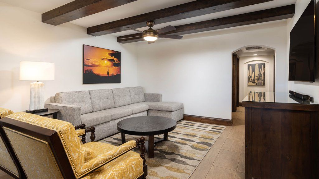 image Relax in the spacious living area, complete with comfortable seating and a cozy ambiance.