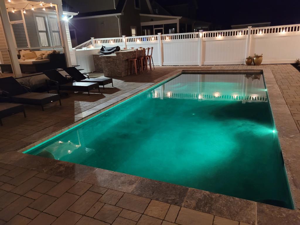 image Experience tranquil evenings by the illuminated pool, perfect for late-night gatherings under the stars.