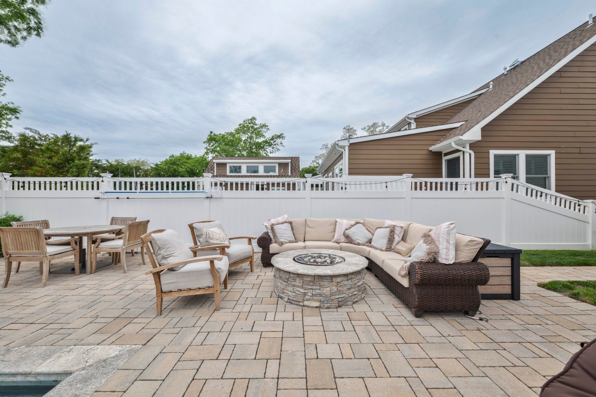 image Cozy up around the fire pit in the spacious outdoor area, perfect for evenings with friends and family.