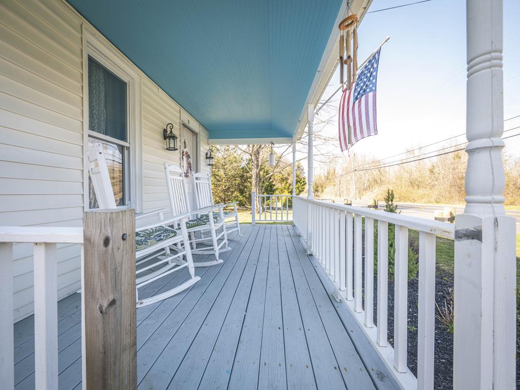 image Covered front porch with rocking chairs, ready for your morning coffee.