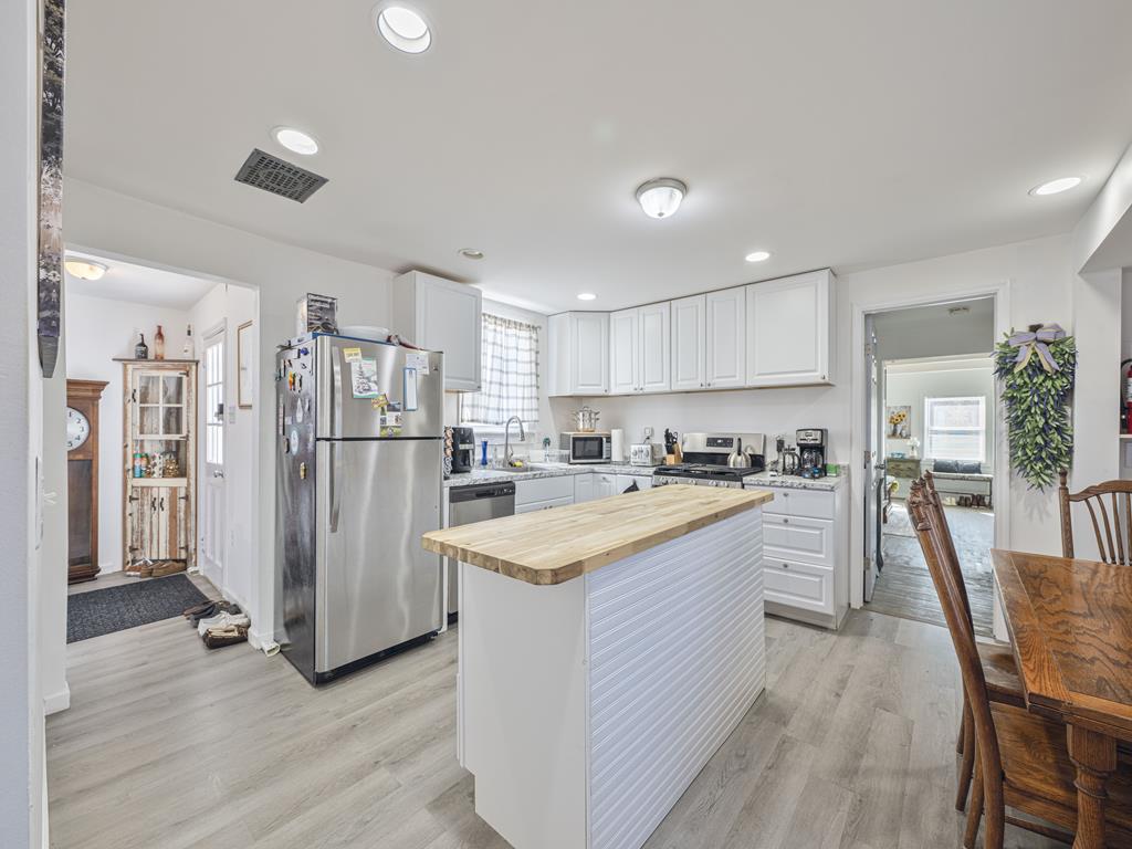 image From the island to the stove, this kitchen is set up for everything from quick breakfasts to full group dinners.