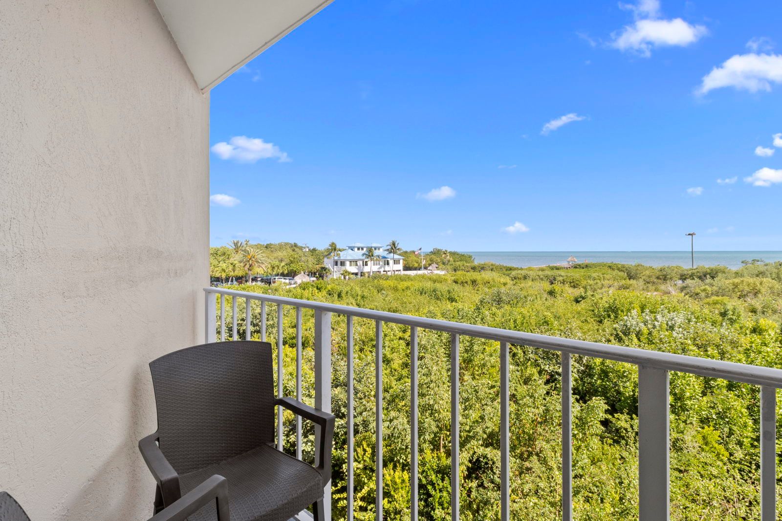 image Step onto your private balcony and enjoy a breath of fresh air with glimpses of the lush surroundings.