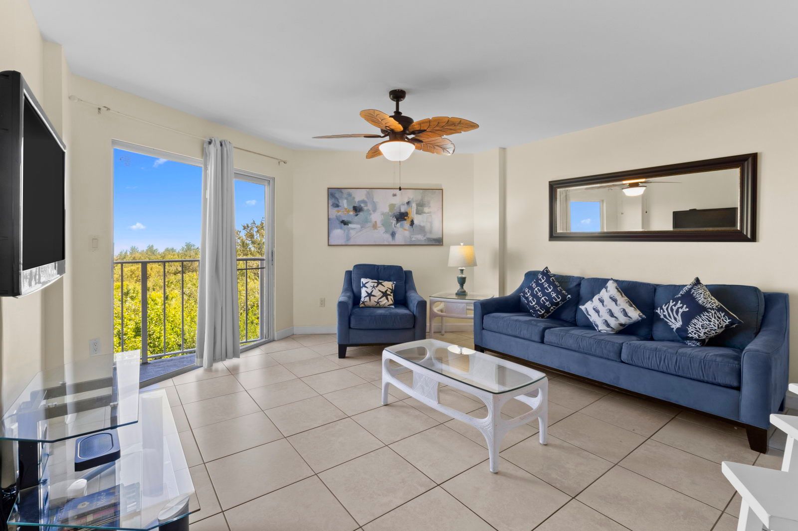 image Relax in the cozy living space, where natural light dances through large windows, inviting comfort and warmth.