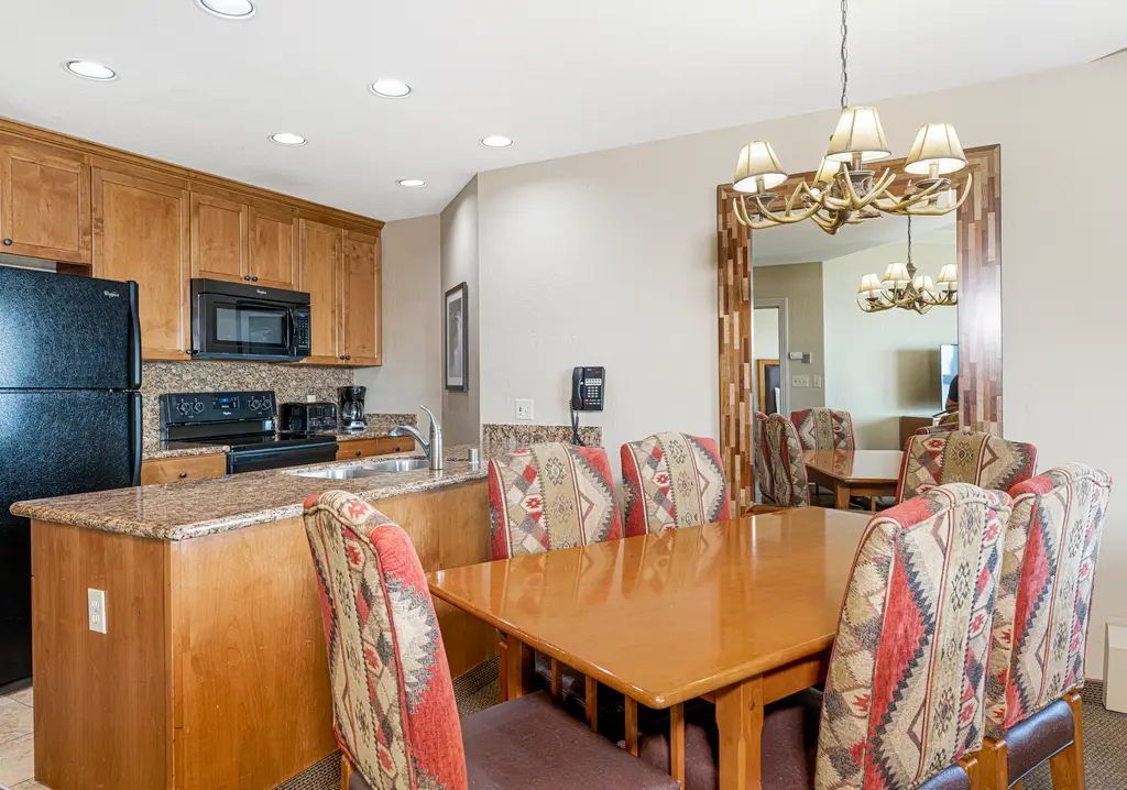 image Fully equipped kitchen with full-size appliances, cookware, and a dining area that seats the whole group.