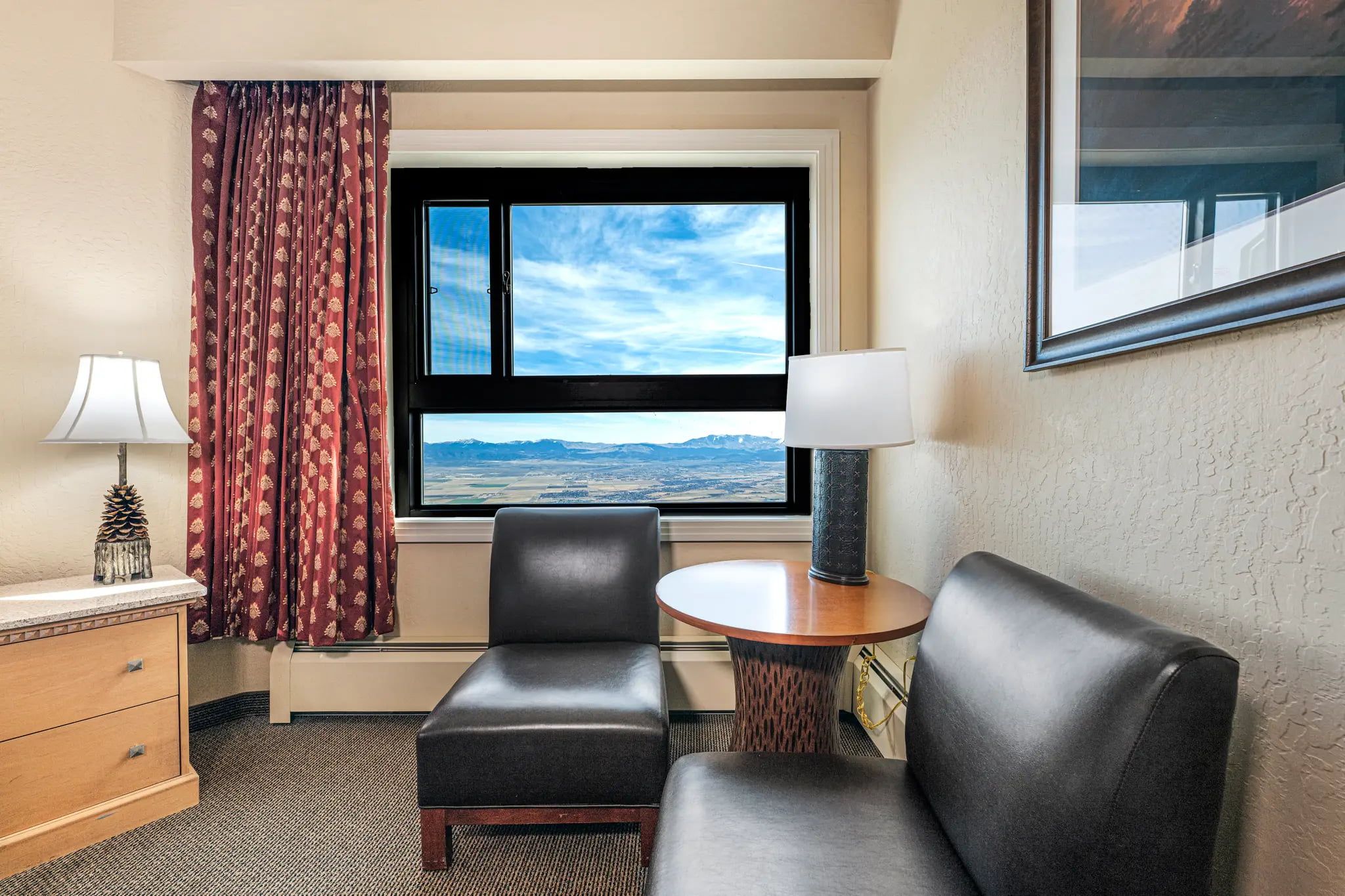 image Enjoy picturesque mountain views from your studio suite while sipping morning coffee or unwinding with an evening drink.