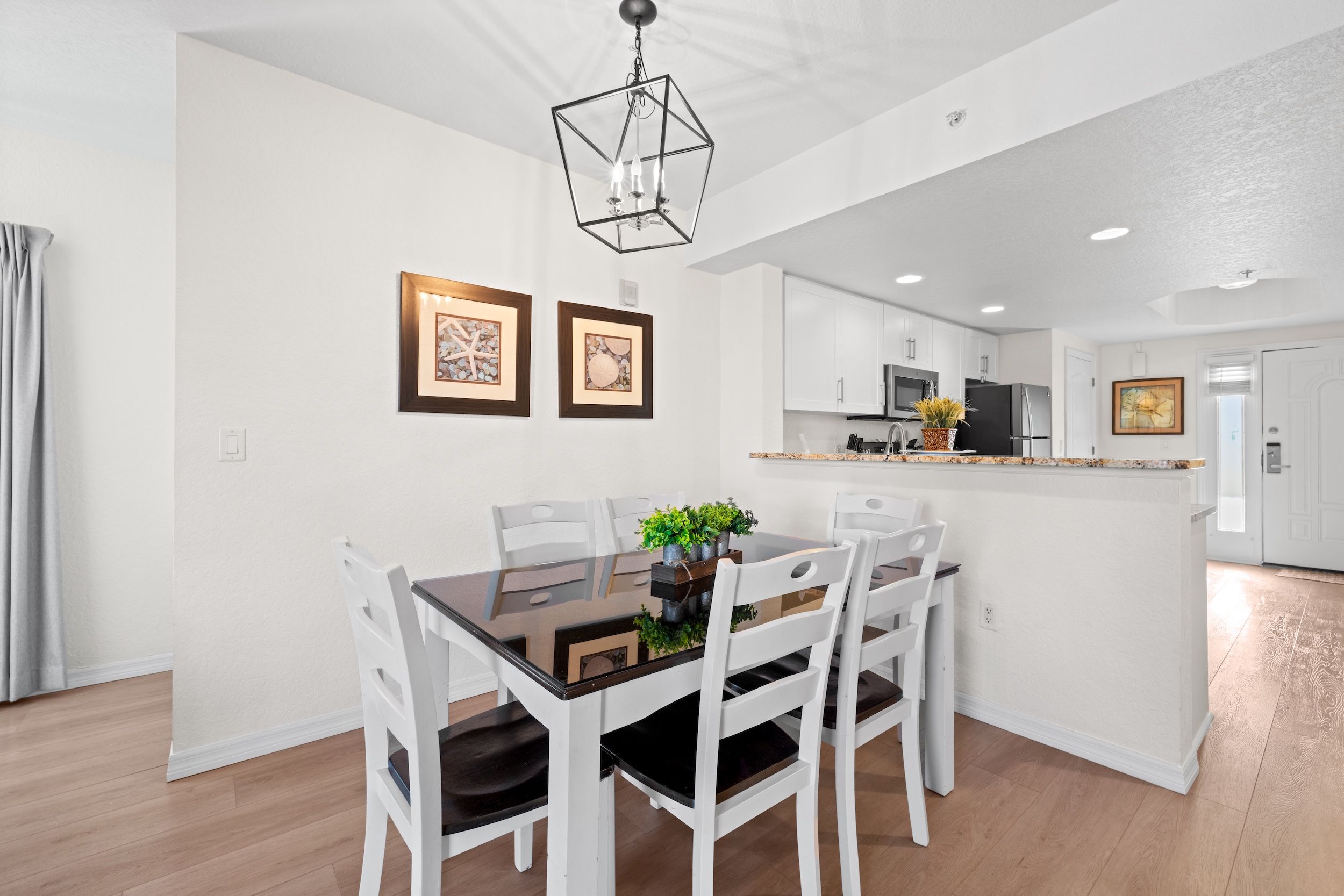 image Enjoy meals at a chic dining area, perfect for gathering with loved ones in a bright, open space.