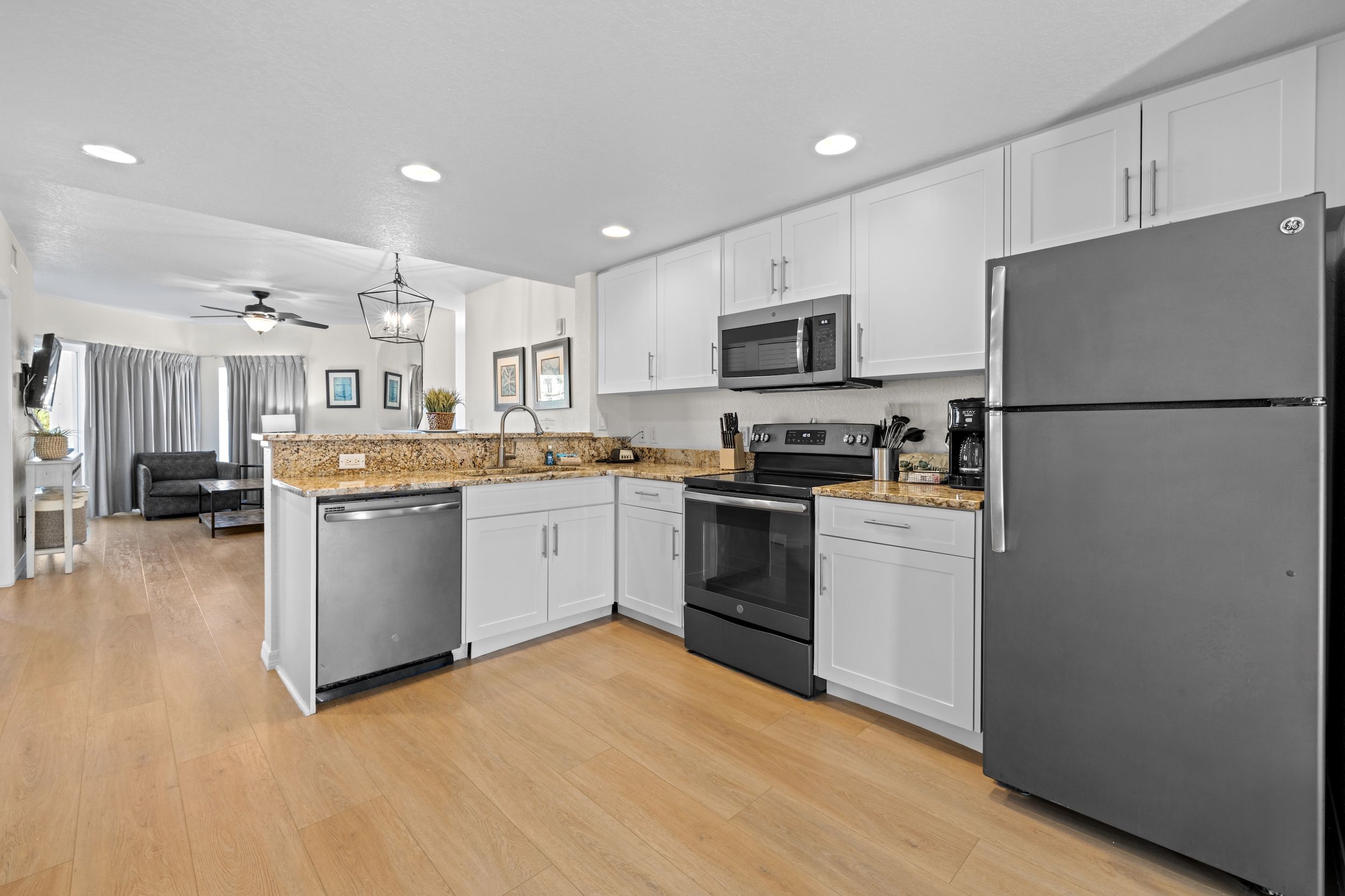 image Cook with ease in a streamlined kitchen, showcasing modern appliances and elegant granite countertops.