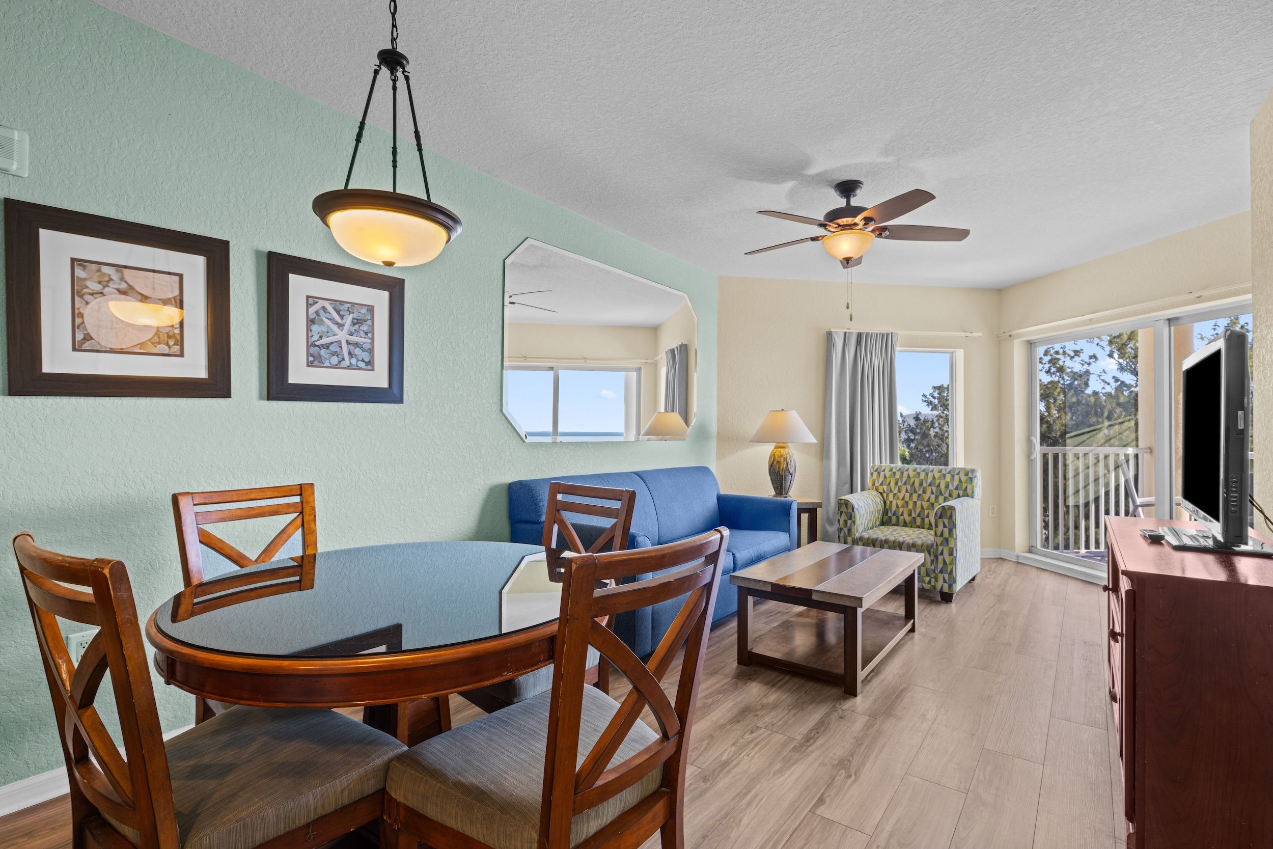 image Relax in this inviting living space with cozy furnishings and natural light streaming in.