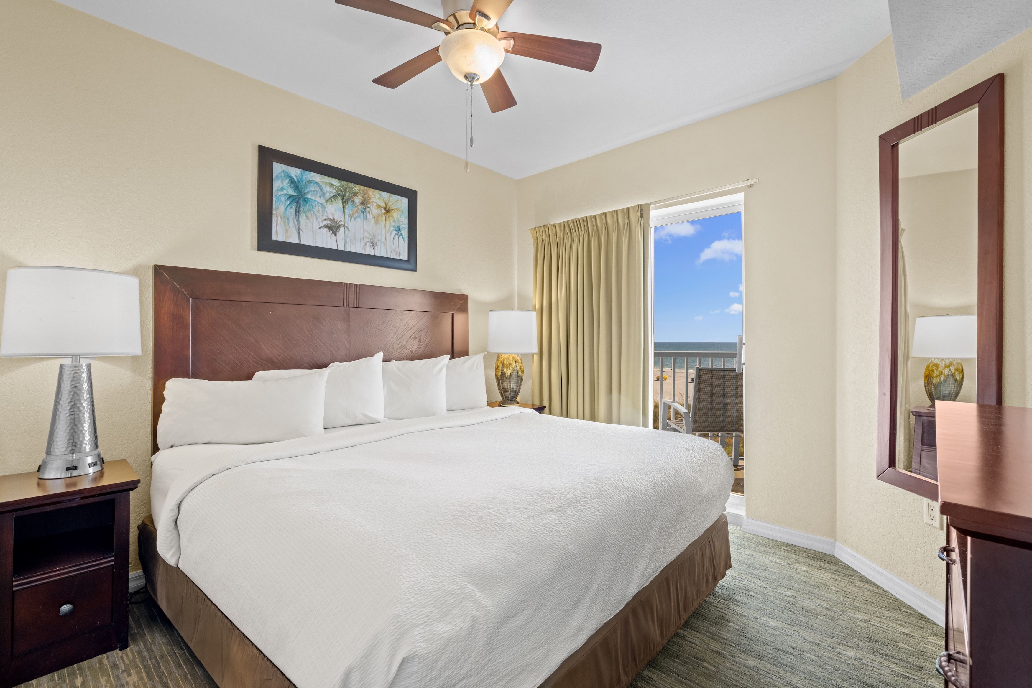 image Wake up to serene mornings in a bright bedroom with direct access to breathtaking beach vistas.