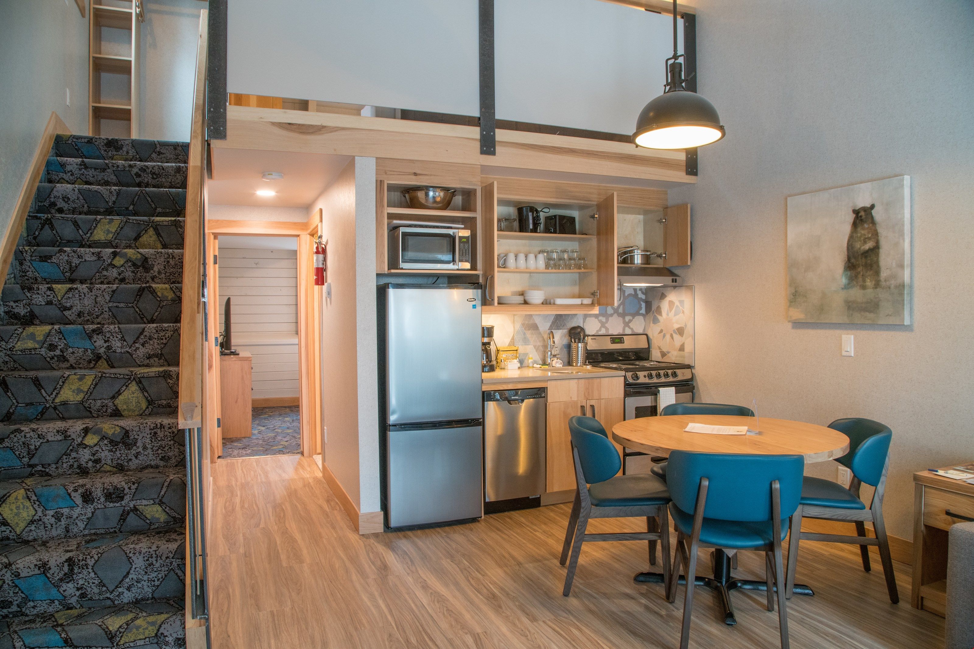 image Our open and bright living area features a functional kitchenette and a dining area.