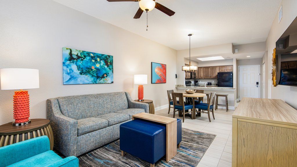 image Relax in the inviting living space, complete with comfortable seating and colorful accents, ideal for family downtime.