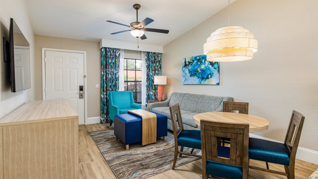 image Unwind in a spacious retreat featuring chic furnishings, a cozy sofa, and natural light streaming in through the windows.