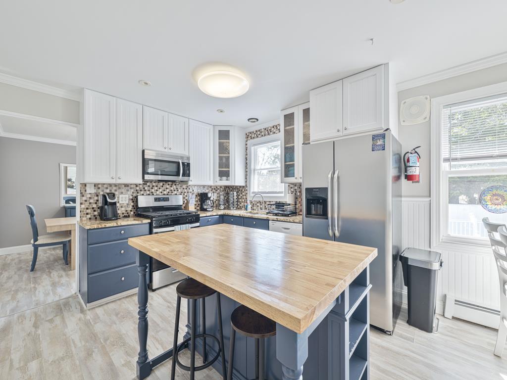 image Enjoy easy meal times at the kitchen island, surrounded by contemporary decor and light-filled spaces.