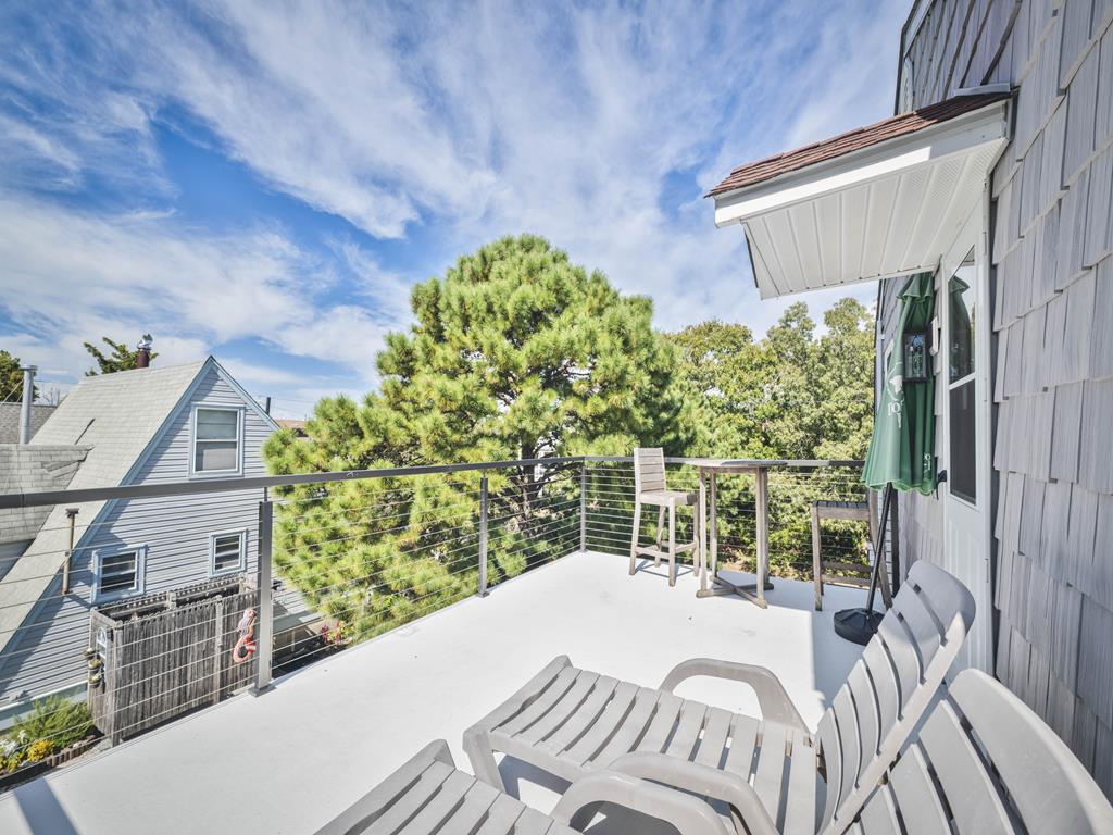 image Enjoy a peaceful moment on the upper deck, featuring seating and a breezy atmosphere.