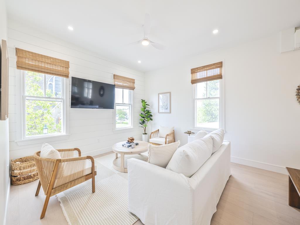image Enjoy a cozy living room filled with natural light, perfect for relaxation and entertainment.
