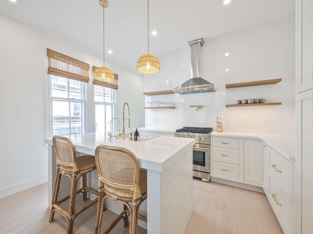 image Sunlit kitchen nook with modern amenities, fostering a warm and welcoming atmosphere.