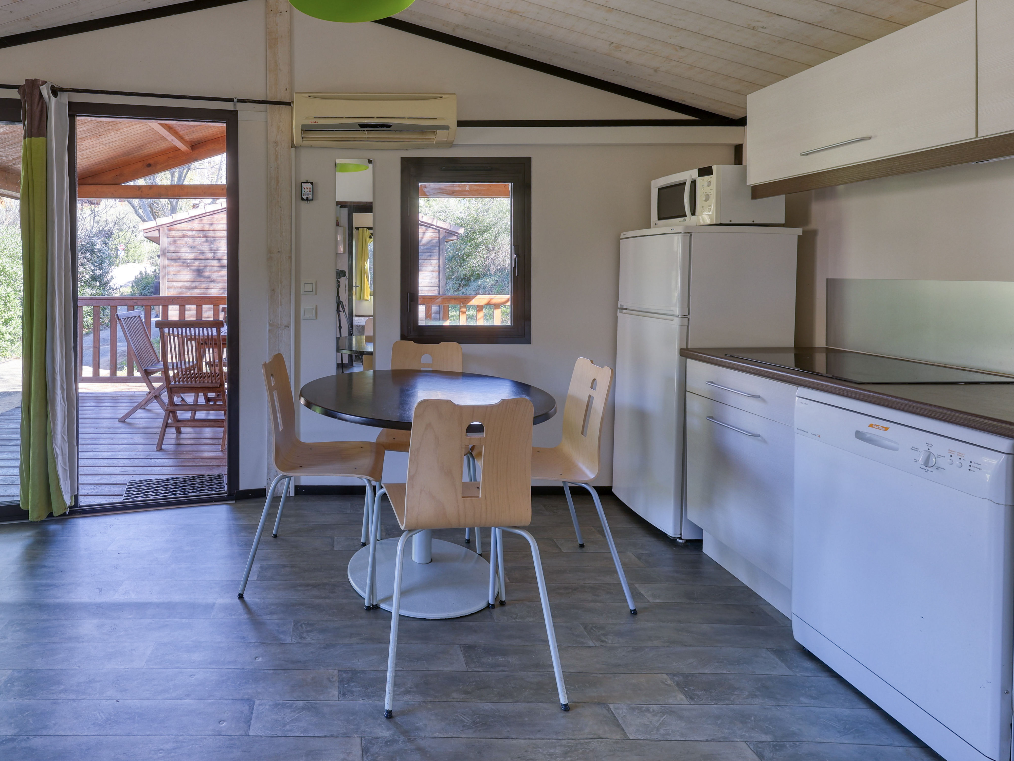 image Enjoy the ease of cooking in a fully equipped kitchen, designed for comfort and convenience during your stay.