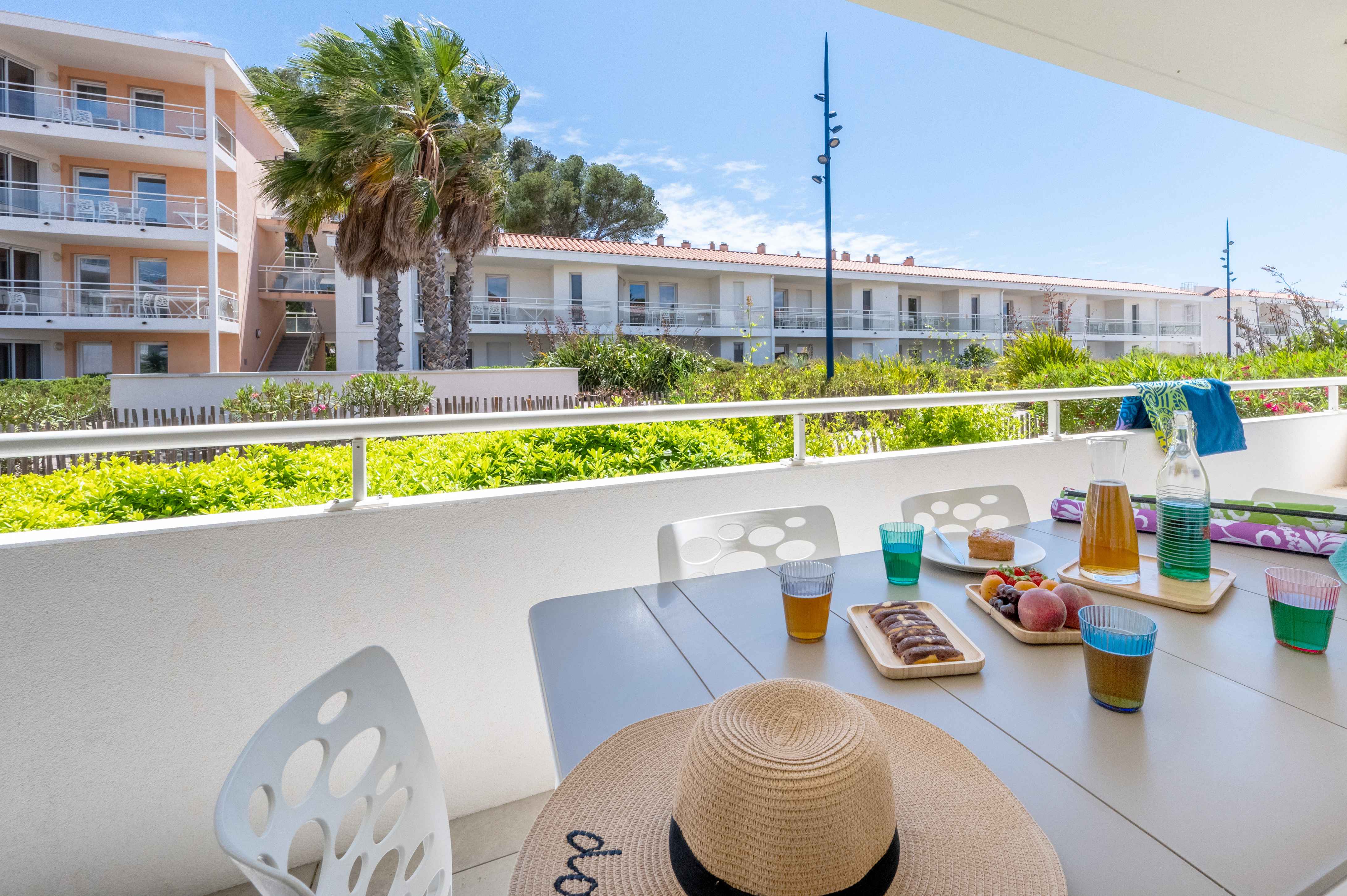 image Sun-drenched terrace with outdoor dining — enjoy your morning coffee or an evening apéritif just steps from the beach.
