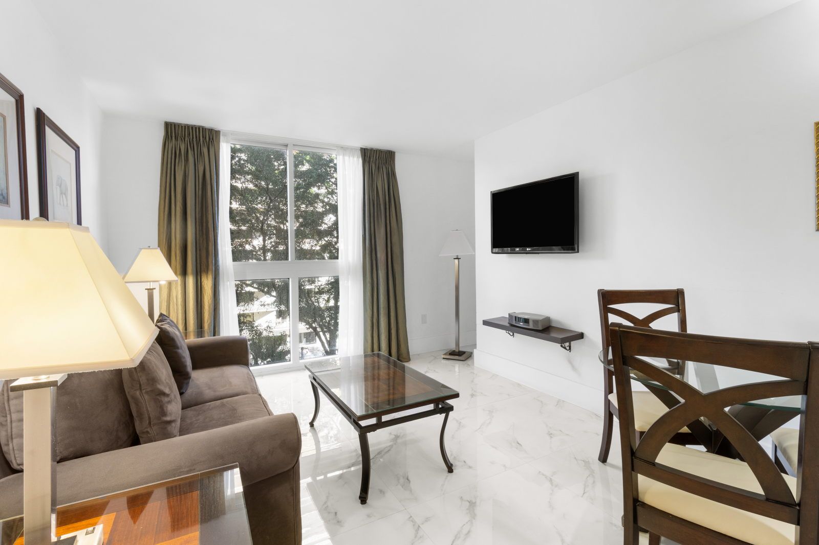 image Sink into comfort on the plush sofa while enjoying the airy brightness from large windows.