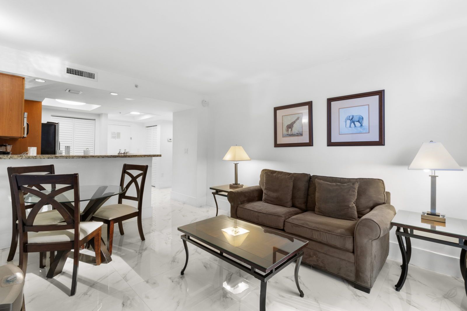 image Step into a bright living area where comfort meets style, adorned with tasteful art and natural light.